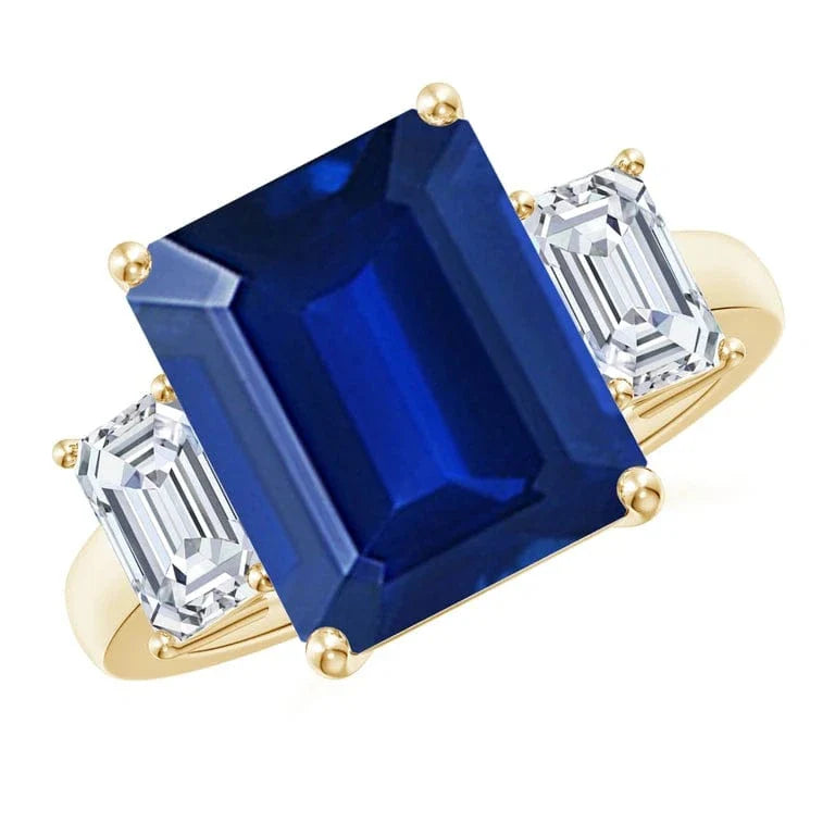 Emerald-Cut 5.5CT Royal Blue Lab-Grown Sapphire Engagement Ring – Three Stone Classic Design with Moissanite Side Stones, 14K Yellow Gold Plated on Tarnish-Resistant Silver(Includes GRC Certification from Gemstone Research Center)