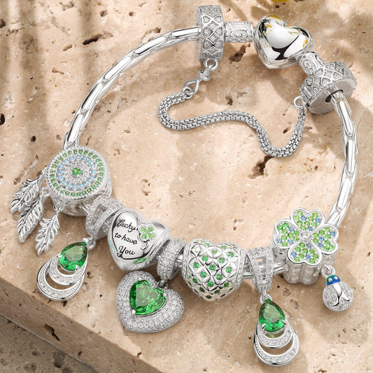 gona- Sterling Silver Emerald Flourish Charms Bracelet Set In White Gold Plated (Includes bracelet and all charms shown)
