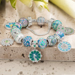Sterling Silver Floral Wonder Charms Bracelet Set In White Gold Plated (Includes bracelet and all charms shown)