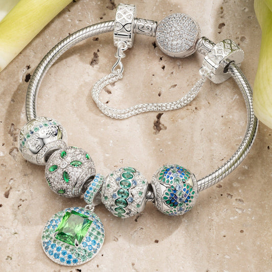 gona- Sterling Silver Emerald Glow Charms Bracelet Set In White Gold Plated (Includes bracelet and all charms shown)