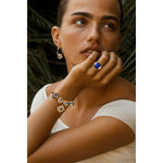 Emerald-Cut 5.5CT Royal Blue Lab-Grown Sapphire Engagement Ring – Three Stone Classic Design with Moissanite Side Stones, 14K Yellow Gold Plated on Tarnish-Resistant Silver（Includes GRC Certification from Gemstone Research Center）